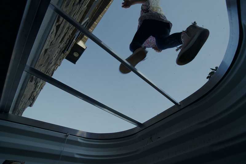 Person on window well cover
